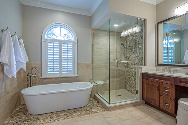 A clean bathroom featuring a shower, sink, and toilet, designed for functionality and comfort—perfect for bathroom remodeling in Hillsborough, CA.