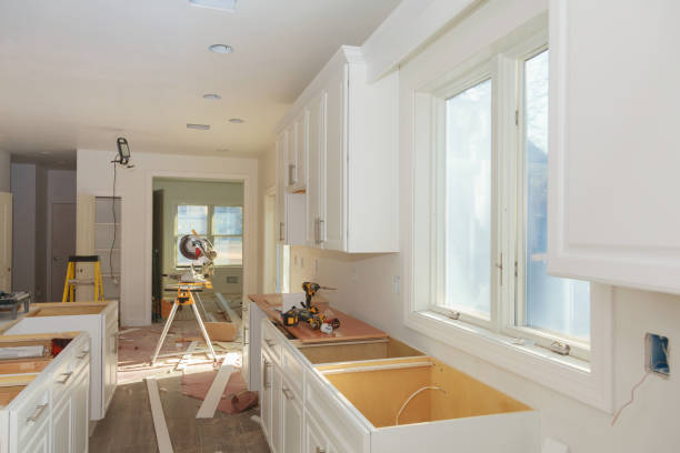 A modern kitchen featuring sleek white cabinets and countertops, creating a bright and inviting atmosphere—perfect for complete home remodeling in Burlingame, CA.