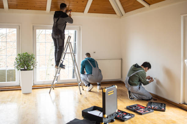 Repairman professionals working on a whole home remodeling project in a client's home, ensuring quality renovations.