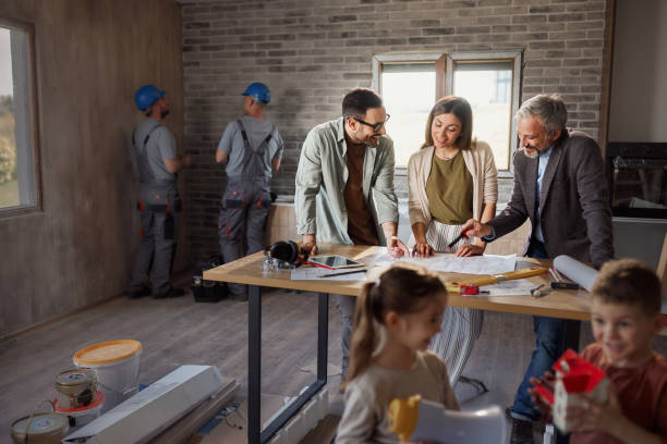 A family collaborates on home improvement tasks, showcasing teamwork and dedication to their complete home remodeling project in Burlingame.