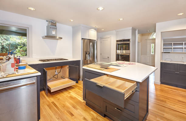 Drawer inserts and pullout tray installed in custom kitchen cabinets during a custom kitchen remodeling project for enhanced organization.