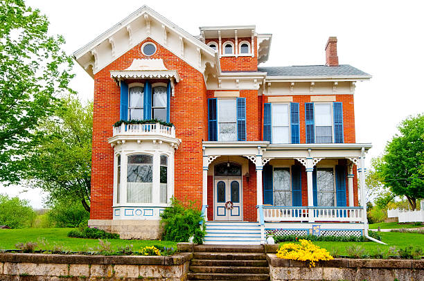San Francisco home remodel of a large red brick house featuring blue trim around windows and doors.